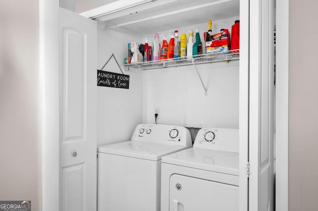 clothes washing area with separate washer and dryer