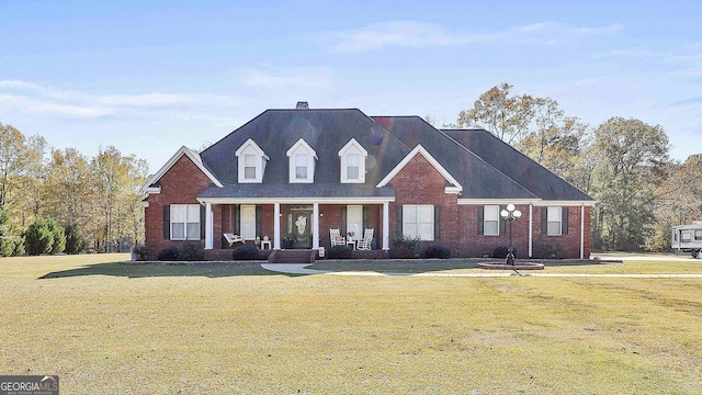 view of front of home featuring a porch and a front lawn