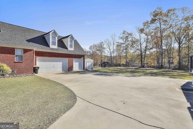 view of property exterior with a lawn and a garage