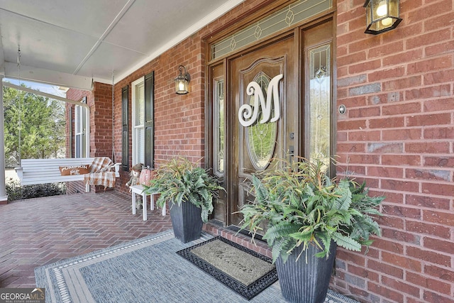 property entrance with covered porch