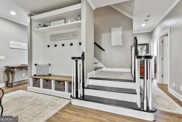 mudroom with hardwood / wood-style floors and ornamental molding