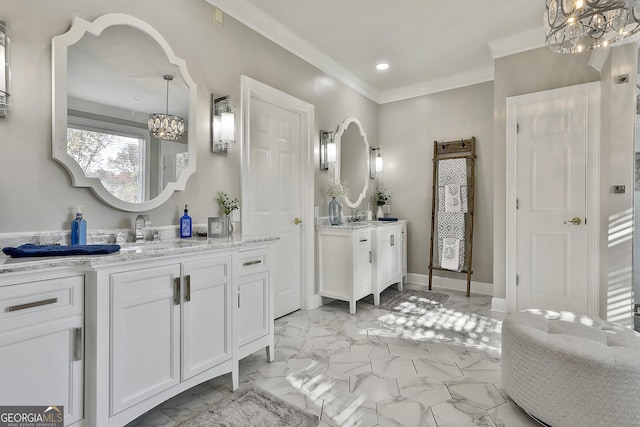 bathroom featuring a chandelier, vanity, and crown molding