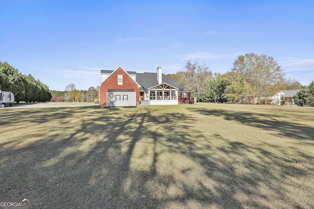 cape cod house featuring a front yard and a sunroom