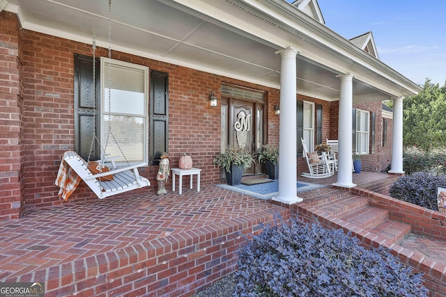 property entrance featuring a porch