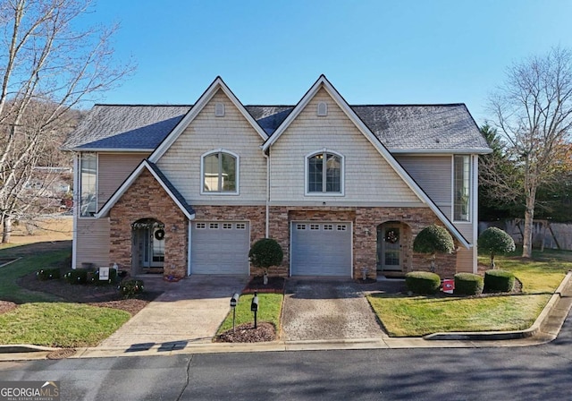 view of front facade featuring a garage and a front lawn