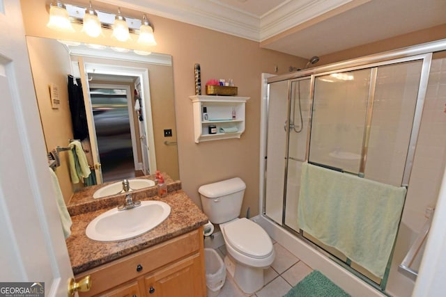 bathroom featuring tile patterned flooring, crown molding, vanity, and walk in shower