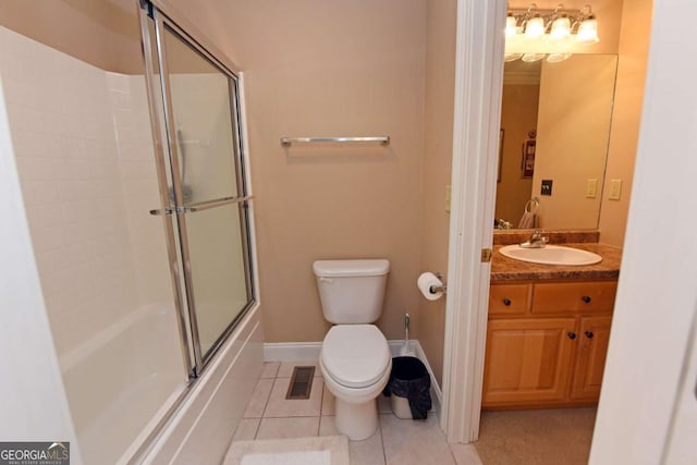 full bathroom featuring tile patterned flooring, vanity, bath / shower combo with glass door, and toilet