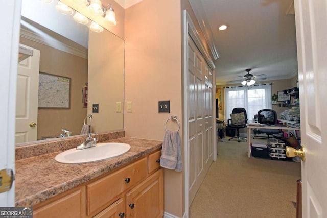 bathroom with vanity, ornamental molding, and ceiling fan