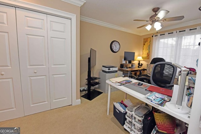 carpeted home office with crown molding and ceiling fan