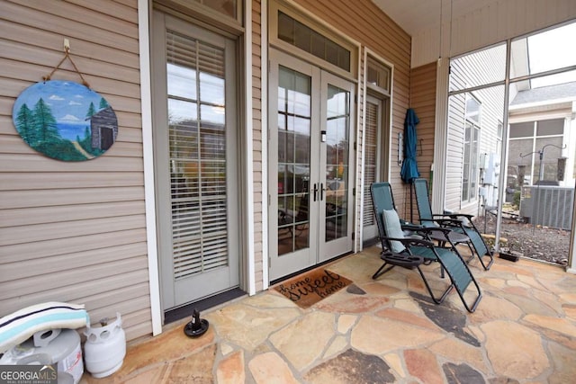 exterior space with french doors and covered porch