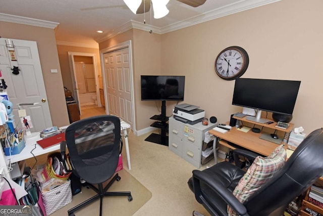 office featuring carpet floors, ceiling fan, and crown molding