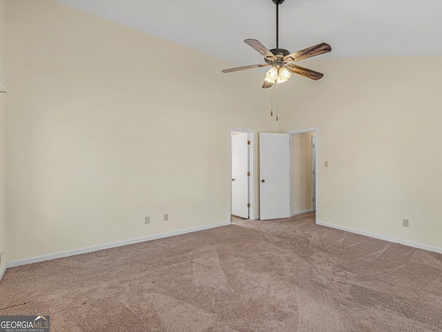 unfurnished bedroom featuring baseboards, ceiling fan, a high ceiling, and light colored carpet