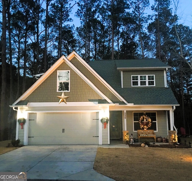 craftsman house with a garage and covered porch