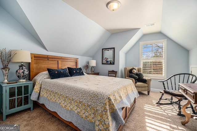 bedroom with vaulted ceiling and carpet