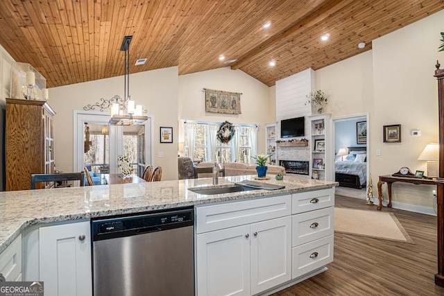 kitchen with beamed ceiling, hanging light fixtures, stainless steel dishwasher, white cabinets, and dark hardwood / wood-style flooring