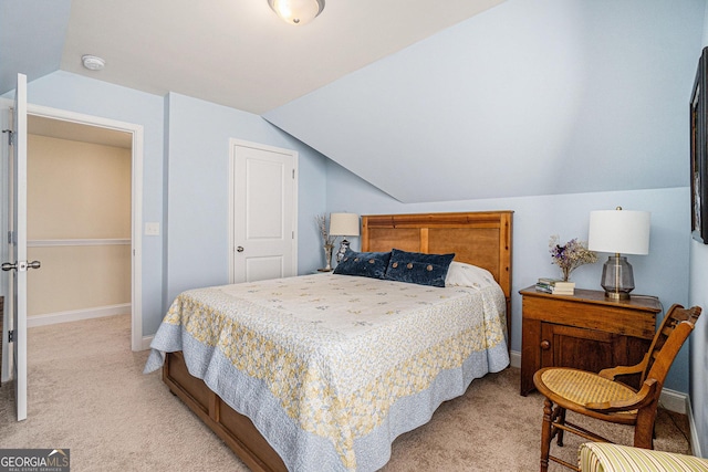 carpeted bedroom featuring vaulted ceiling