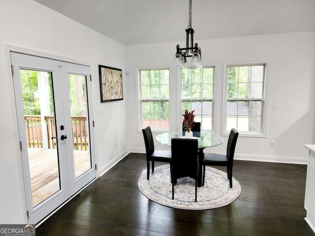 dining room with dark hardwood / wood-style flooring and french doors