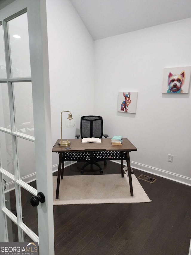 home office with wood-type flooring