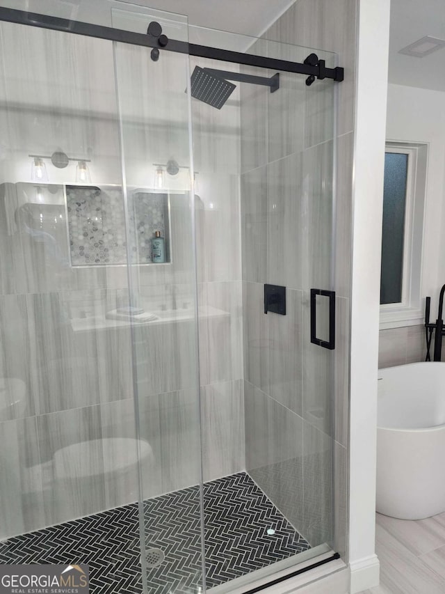 bathroom with independent shower and bath