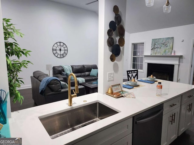 kitchen with dishwasher, gray cabinetry, and sink