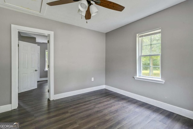 unfurnished room with ceiling fan and dark hardwood / wood-style floors