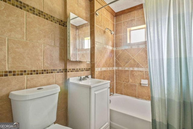 full bathroom with shower / bath combination with curtain, vanity, toilet, and tile walls