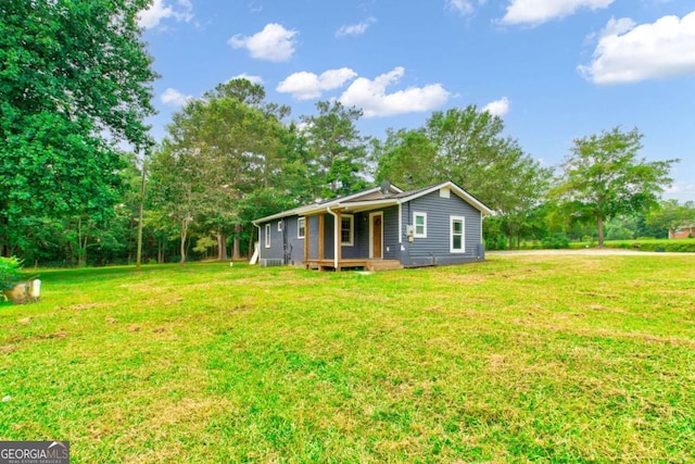 view of front of home with a front lawn and covered porch