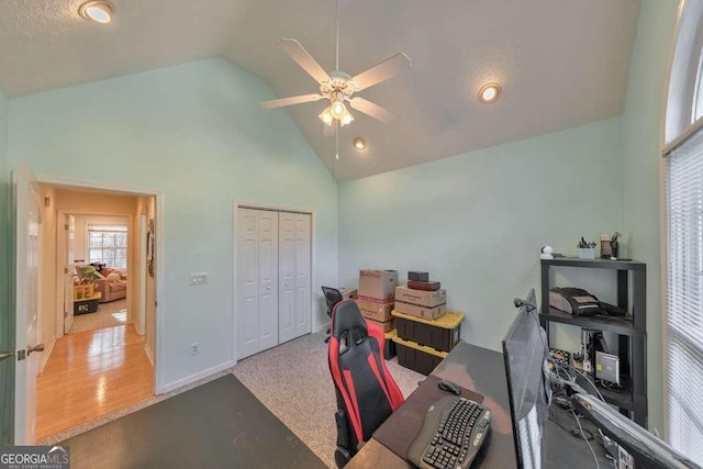 office featuring ceiling fan and high vaulted ceiling