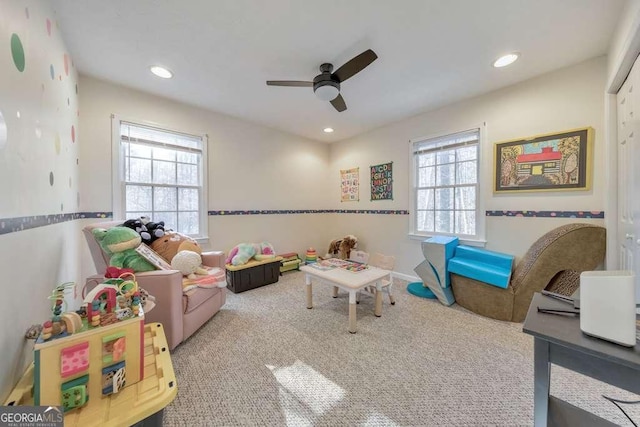 playroom featuring ceiling fan and carpet flooring