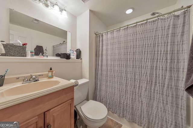 bathroom with vanity and toilet