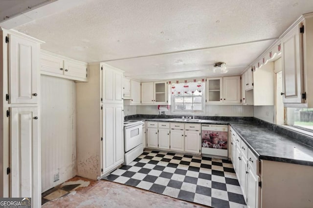 kitchen featuring a textured ceiling, white cabinetry, white appliances, and sink