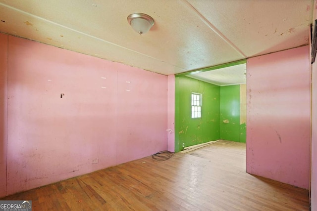 spare room with light wood-type flooring