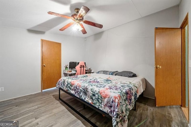 bedroom featuring ceiling fan and hardwood / wood-style flooring