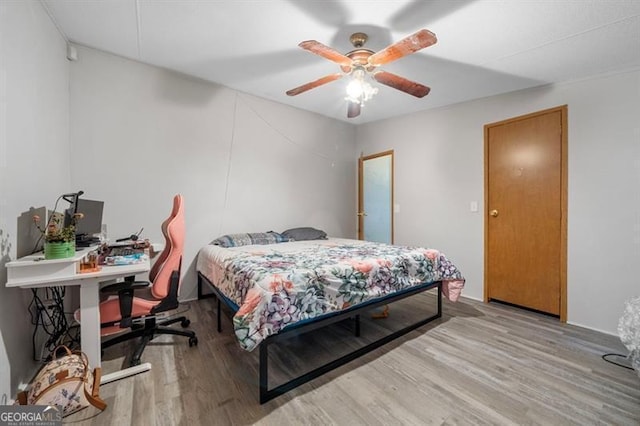 bedroom featuring ceiling fan and light wood-type flooring