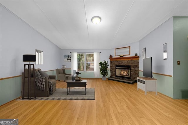 living room featuring a fireplace and light hardwood / wood-style flooring