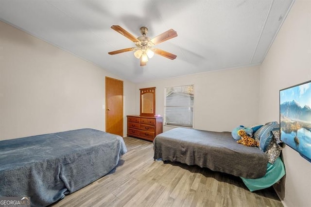 bedroom featuring light wood-type flooring and ceiling fan