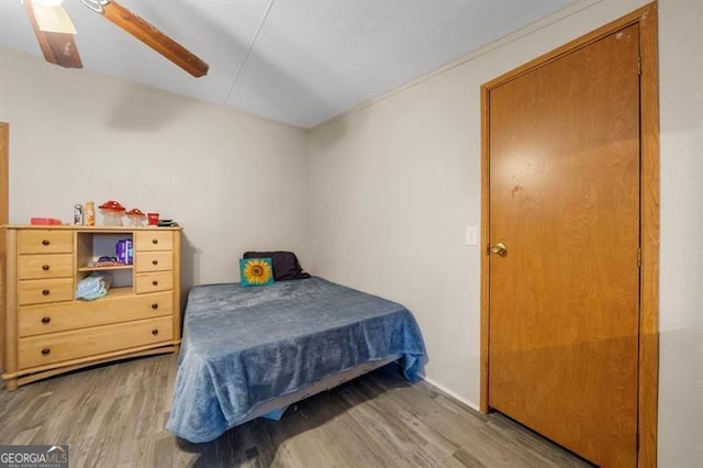 bedroom with hardwood / wood-style flooring and ceiling fan