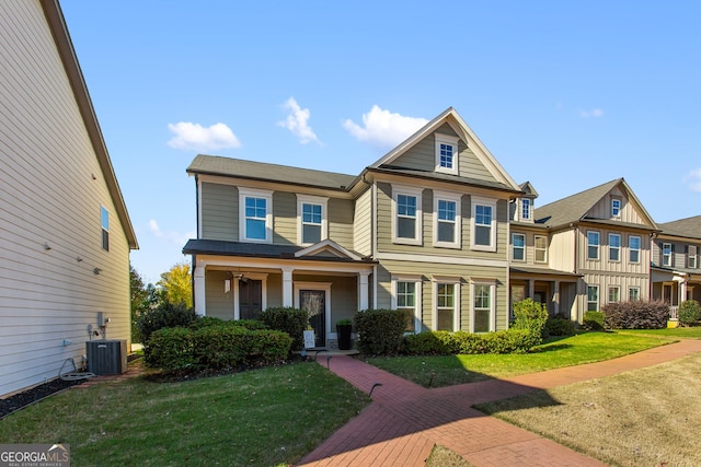 view of front of home featuring cooling unit and a front lawn