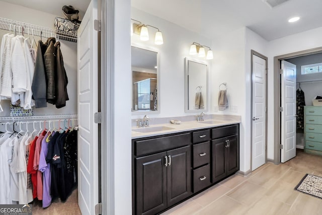 bathroom with tile patterned floors and vanity