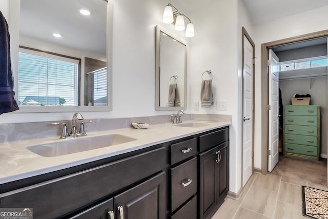 bathroom with tile patterned flooring and vanity