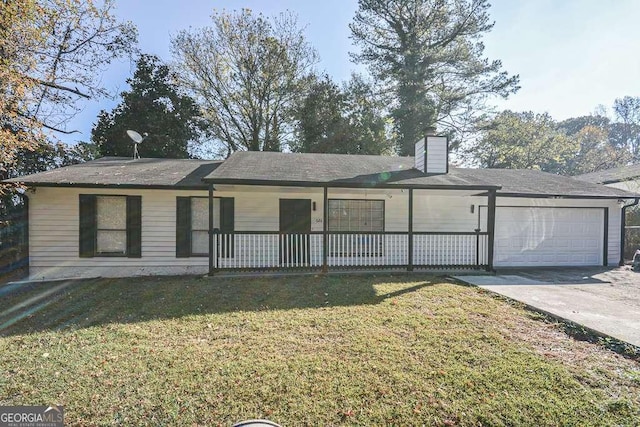 ranch-style house featuring covered porch, a garage, and a front yard