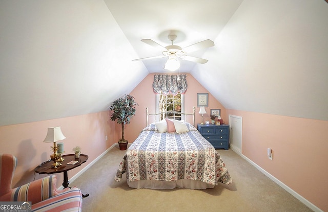 bedroom featuring ceiling fan, light carpet, and vaulted ceiling