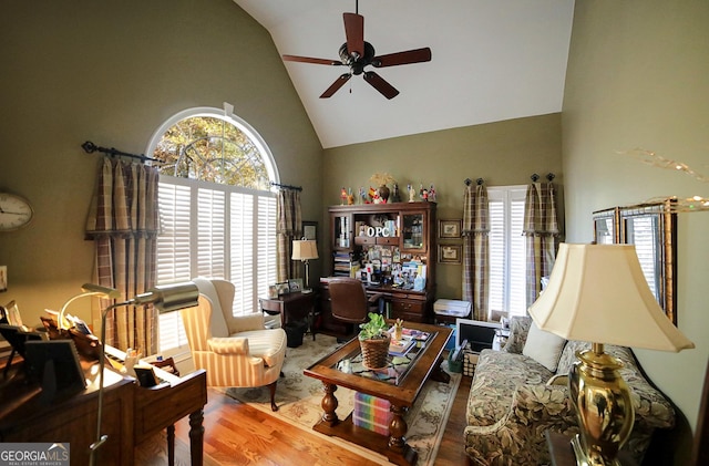 living room featuring ceiling fan, a healthy amount of sunlight, and wood-type flooring