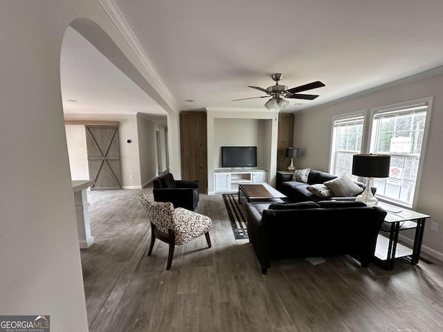 living room featuring ceiling fan, dark hardwood / wood-style flooring, and ornamental molding