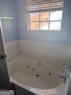 bathroom with a tub