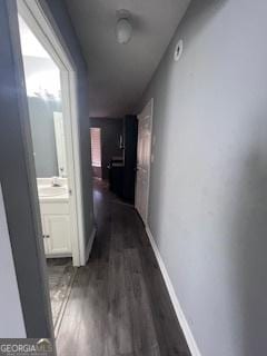 hallway with dark hardwood / wood-style floors