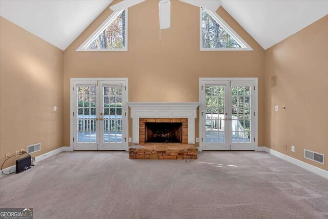 unfurnished living room with plenty of natural light and french doors