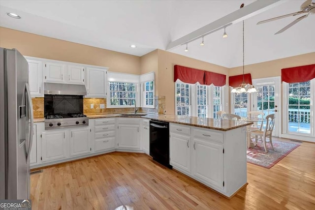 kitchen featuring kitchen peninsula, appliances with stainless steel finishes, light wood-type flooring, light stone counters, and white cabinets