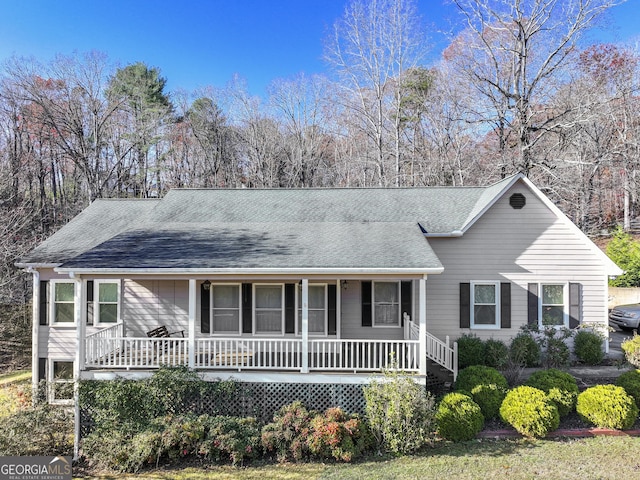 ranch-style house featuring covered porch