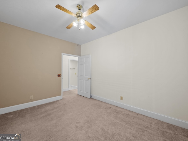 carpeted empty room with ceiling fan